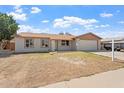 Well-kept home featuring a neat front yard and attached two-car garage in a tranquil neighborhood at 5431 W Sierra St, Glendale, AZ 85304