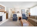 Relaxing living room with a fireplace, chairs, and Southwest-inspired decor at 5525 E Thomas Rd # N5, Phoenix, AZ 85018