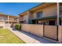Well-kept townhouse featuring multiple balconies and gated patios, perfect for outdoor living at 6565 N 19Th Ave # 59, Phoenix, AZ 85015