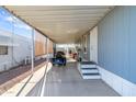 Covered carport parking area with direct access to the home's entrance at 7807 E Main St # E-38, Mesa, AZ 85207