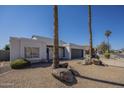 Charming single-story home with desert landscaping, rock accents, and a two-car garage at 801 E Piute Ave, Phoenix, AZ 85024