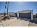 Charming single-story home with desert landscaping, rock accents, and a two-car garage at 801 E Piute Ave, Phoenix, AZ 85024