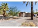 The home features a spacious carport and a low-maintenance desert landscape at 825 W 12Th St, Tempe, AZ 85281