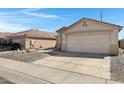 A single story home with a two car garage and low maintenance landscaping at 10515 W Pasadena Ave, Glendale, AZ 85307