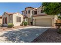 Two story stucco house with a terracotta roof and a two car garage at 12603 W Blackstone Ln, Peoria, AZ 85383