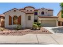 Two story stucco house with a terracotta roof and a two car garage at 12603 W Blackstone Ln, Peoria, AZ 85383