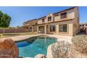 Backyard view of a private pool and patio area at 12603 W Blackstone Ln, Peoria, AZ 85383