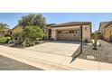 Charming home with a well-maintained desert landscape and a spacious two-car garage at 13055 W Cliffrose Rd, Peoria, AZ 85383