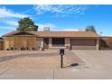 Charming single-story home featuring a two-car garage and low-maintenance landscaping at 1604 W Kerry Ln, Phoenix, AZ 85027