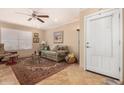 Cozy living room features a comfortable sofa, accent rug, and neutral decor at 16657 E Gunsight Dr # 181, Fountain Hills, AZ 85268