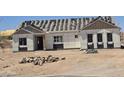 Under-construction single-Gathering home with newly installed windows at 1800 W Caramel Ct, Queen Creek, AZ 85144