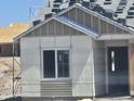 Under construction home with visible exterior and wrapped window in a desert landscape at 1800 W Caramel Ct, Queen Creek, AZ 85144