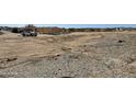 New construction site with a truck next to the new home's wood frame at 1800 W Caramel Ct, Queen Creek, AZ 85144