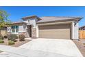 Beautiful one-story house with stone accents, low-maintenance landscaping, and an attached two-car garage at 22854 E Pummelos Rd, Queen Creek, AZ 85142