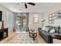 Inviting living room with neutral tones, stylish rug, comfortable seating, and sliding glass doors at 2512 E Vermont Dr, Gilbert, AZ 85295