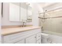 Bathroom with shower-tub combo, vanity, and sink at 4233 W Paradise Dr, Phoenix, AZ 85029