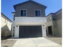 Charming two-story home with a gray exterior and a two-car garage at 4517 S Mole --, Mesa, AZ 85212