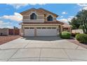 Two-story home featuring a three-car garage and well-maintained landscaping at 5471 W Quail Ave, Glendale, AZ 85308