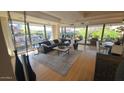 Open-concept living space featuring floor-to-ceiling windows with views of the surrounding area and stylish decor at 7147 E Rancho Vista Dr # 7004, Scottsdale, AZ 85251
