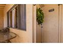 Cozy front door with table and chairs near the window at 8055 E Thomas Rd # E110, Scottsdale, AZ 85251