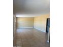 A living room with beige walls and tile floors at 813 N Trekell Rd, Casa Grande, AZ 85122