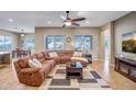 Large living room featuring a generous sectional, well-placed windows, and an open design, ideal for gatherings at 9336 W Louise Dr, Peoria, AZ 85383