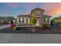 Lovely home showcasing attractive landscaping with stone accents and neutral tones at 10110 W El Cortez Pl, Peoria, AZ 85383