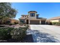 Charming home with neutral stucco, desert landscaping, and a spacious 3-car garage at 17531 W Hedgehog Pl, Surprise, AZ 85387