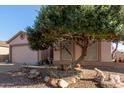 Charming single-Gathering home with a well-maintained front yard and a two-car garage, bathed in warm sunlight at 1871 E Westchester Dr, Chandler, AZ 85249