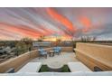 Rooftop deck with lounge chairs, table and beautiful sunset views at 24200 N Alma School Rd # 4, Scottsdale, AZ 85255