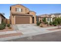 Inviting two-story home with a two-car garage and low-maintenance front yard landscaping at 25451 N 164Th Dr, Surprise, AZ 85387