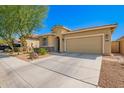 Inviting curb appeal with desert landscaping, driveway, and well-maintained exterior at 3235 W Carter Rd, Phoenix, AZ 85041