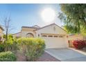 Charming single-story home featuring a two-car garage, desert landscaping, and a welcoming entryway at 3890 S Star Canyon Dr, Gilbert, AZ 85297