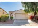 Charming single-story home featuring a two-car garage, desert landscaping, and a welcoming entryway at 3890 S Star Canyon Dr, Gilbert, AZ 85297