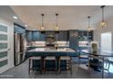 Modern kitchen featuring custom cabinets, stainless steel appliances, and pendant lighting at 7209 E Mcdonald Dr # 51, Scottsdale, AZ 85250