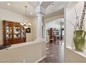 Grand entryway with tile flooring, decorative columns, and high ceilings, exuding elegance at 859 E Teakwood Dr, Chandler, AZ 85249