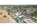 Aerial view of the property showing the backyard pool, patio, and surrounding neighborhood at 92 N Palm St, Gilbert, AZ 85234