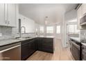 Modern kitchen with gray countertops, stainless steel appliances, and white cabinetry at 9820 N Central Ave # 130, Phoenix, AZ 85020