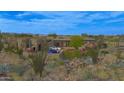 Stunning home in a desert landscape featuring a luxurious outdoor living space at 10354 E Celestial Dr, Scottsdale, AZ 85262
