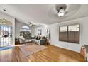 Inviting living room with wood-look floors, and a comfortable gray sofa at 10778 W Via Del Sol --, Peoria, AZ 85373