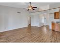 Bright living room featuring wood-look floors, a vaulted ceiling, and an open layout at 108 W Ivyglen St, Mesa, AZ 85201