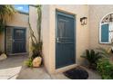 Inviting entrance with secure screen doors, desert landscaping, and a well-lit exterior at 1173 E Beryl Ave, Phoenix, AZ 85020