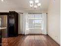 Bright dining area with wood floors, large window and chandelier at 1633 E Lakeside Dr # 106, Gilbert, AZ 85234