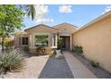 Inviting single-story home with a meticulously maintained desert landscape and bay window at 16564 W Wild Horse Way, Surprise, AZ 85387