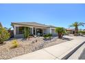 Beautiful single-story home with low-maintenance desert landscaping and a charming facade at 17637 W Browning Dr, Surprise, AZ 85374