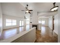 Spacious living area features a fireplace, tile floors, vaulted ceilings and an open floor plan at 1833 E Redfield Rd, Phoenix, AZ 85022