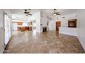 Bright living room featuring a fireplace, tile floors, vaulted ceilings and an open floor plan at 1833 E Redfield Rd, Phoenix, AZ 85022
