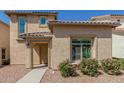 Charming single-Gathering home featuring desert landscaping, a tile roof, and a covered entry at 1926 W Busoni Pl, Phoenix, AZ 85023