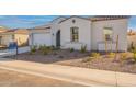 Landscaped front yard and charming details create a welcoming curb appeal at 35703 N Geode Way, San Tan Valley, AZ 85144