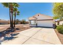 Charming single-story home with a well-manicured front yard and a two-car garage at 39894 N Fazio Ln, San Tan Valley, AZ 85140
